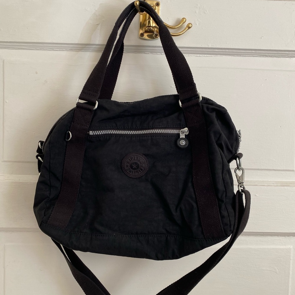 Kipling Small Black Duffle Bag with Beige Interior and Black Straps